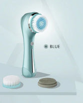 Blue electric facial cleansing brush with two interchangeable brush heads on a light background.